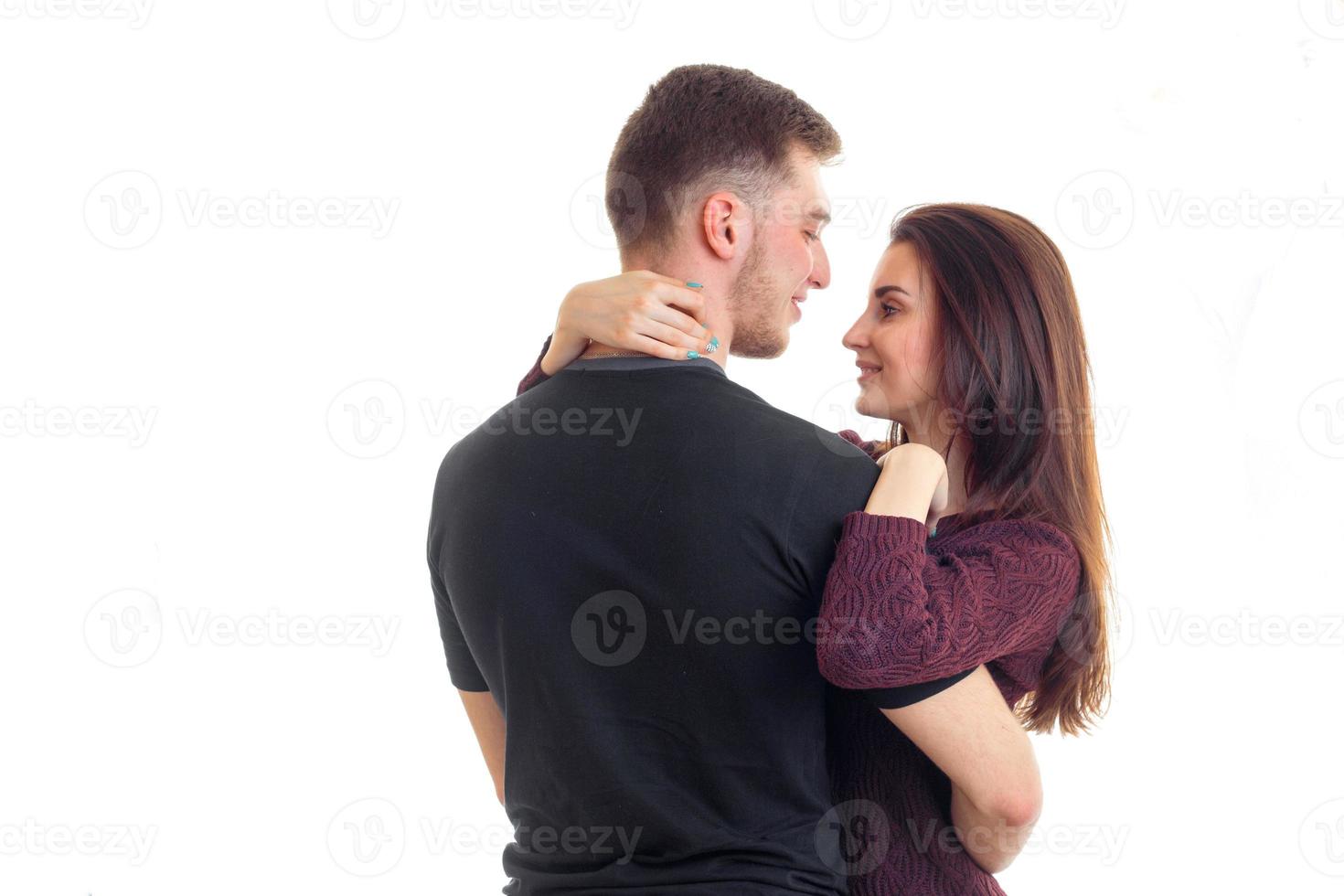 beautiful charming couple look and embrace each other is isolated on a white background photo