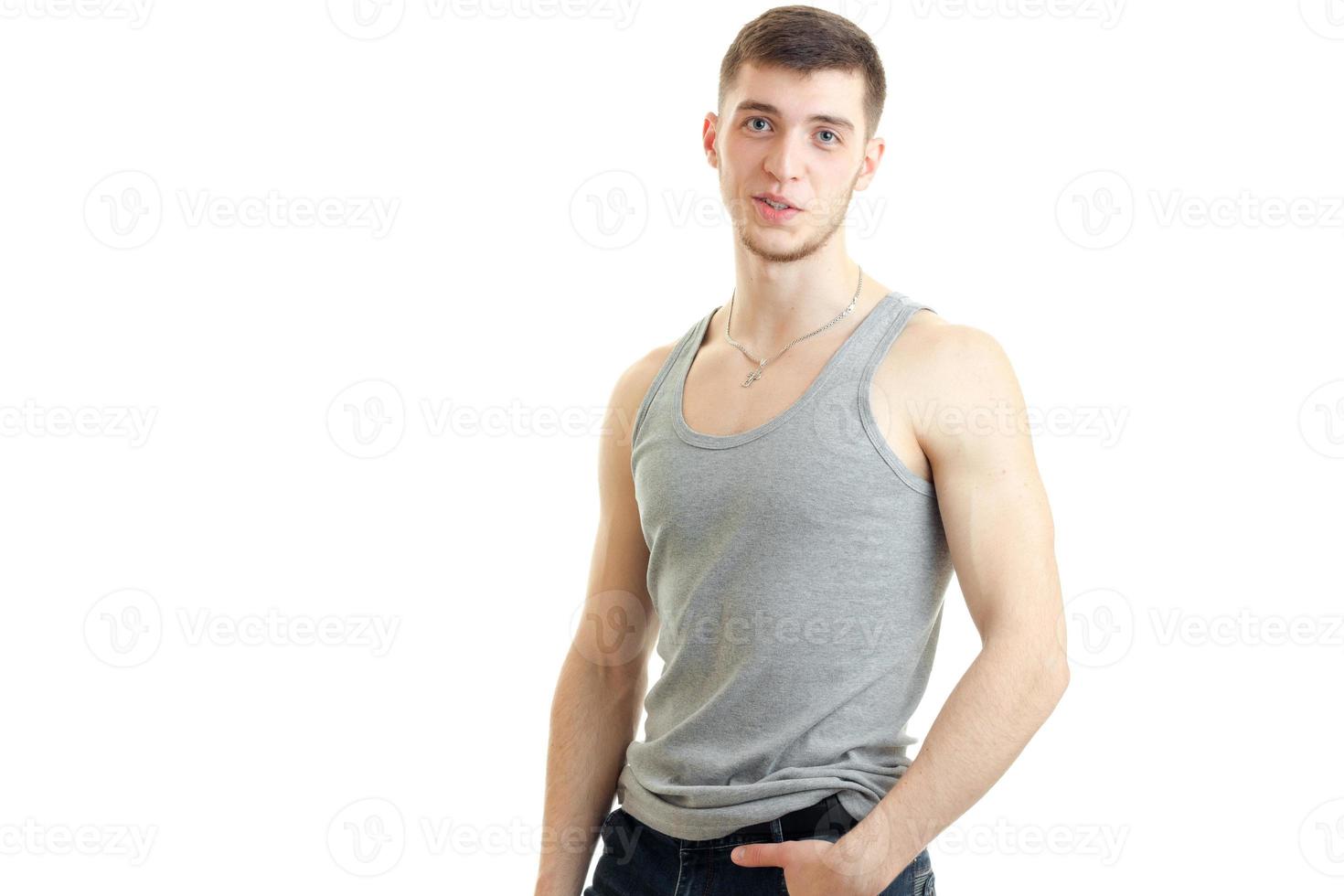 horizontal portrait of beautiful sexual guy in the gray shirt photo