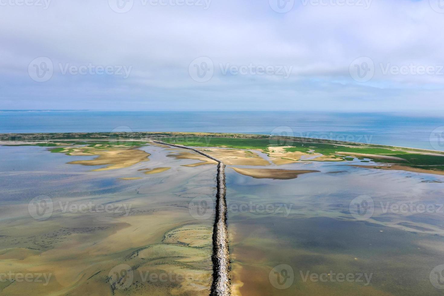 Provincetown Causeway also known as the Breakwater Walk, is an uneven collection of rocks that allows hikers to cross the harbor and reach the very tip of the Cape. photo