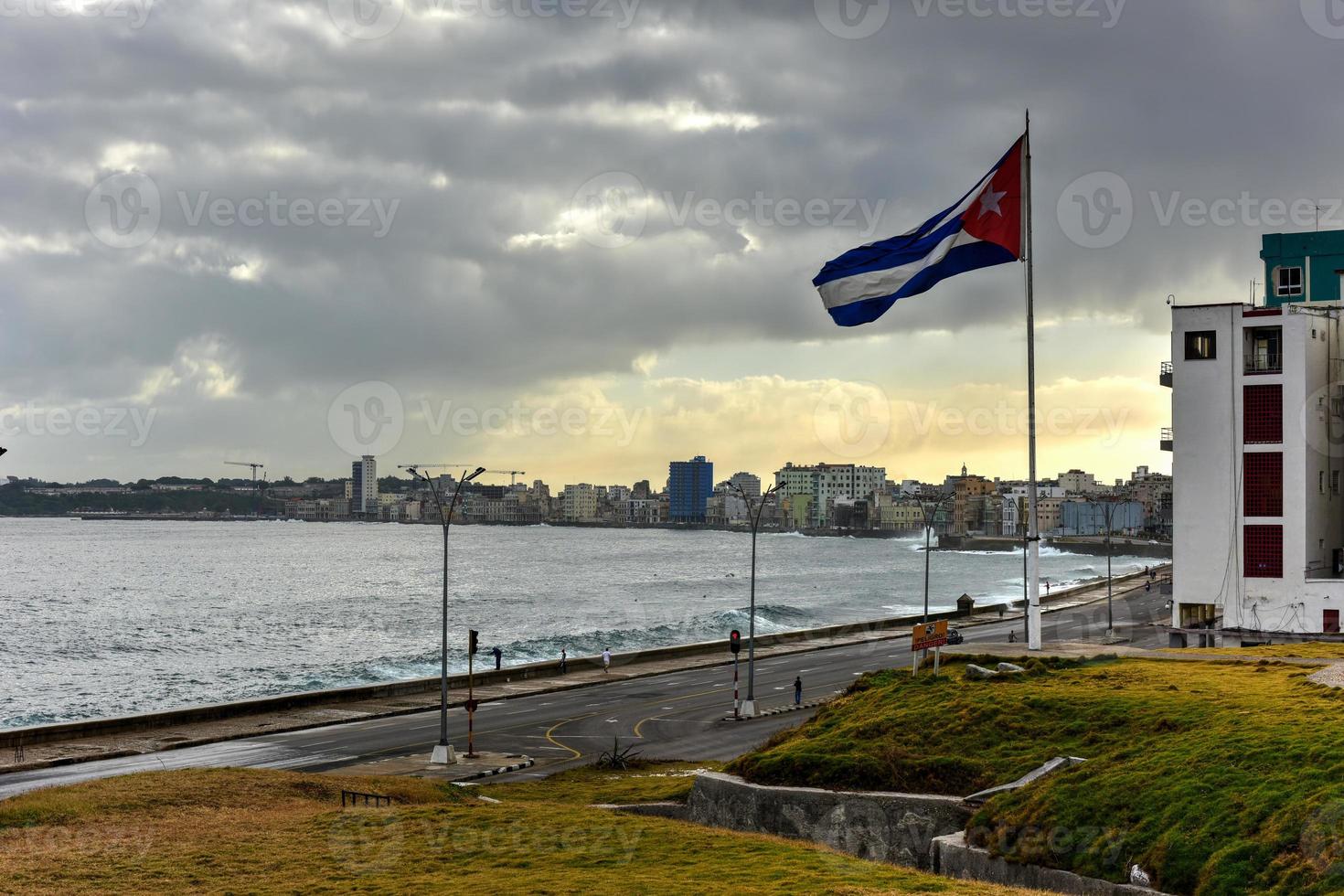 The Malecon in Havana. It is a broad esplanade, roadway and seawall which stretches for 8 km along the coast in Havana, Cuba. photo