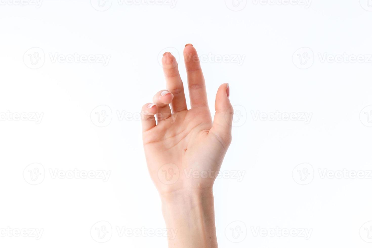 female hand showing the gesture with palms forward, isolated on white background photo