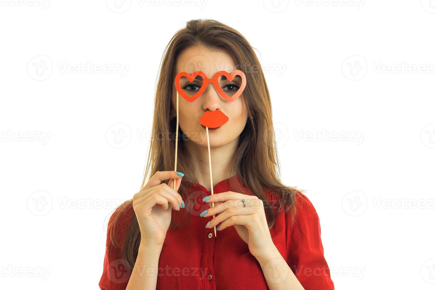 young charming girl stands in front of the camera and holds near person paper Dummies for photo