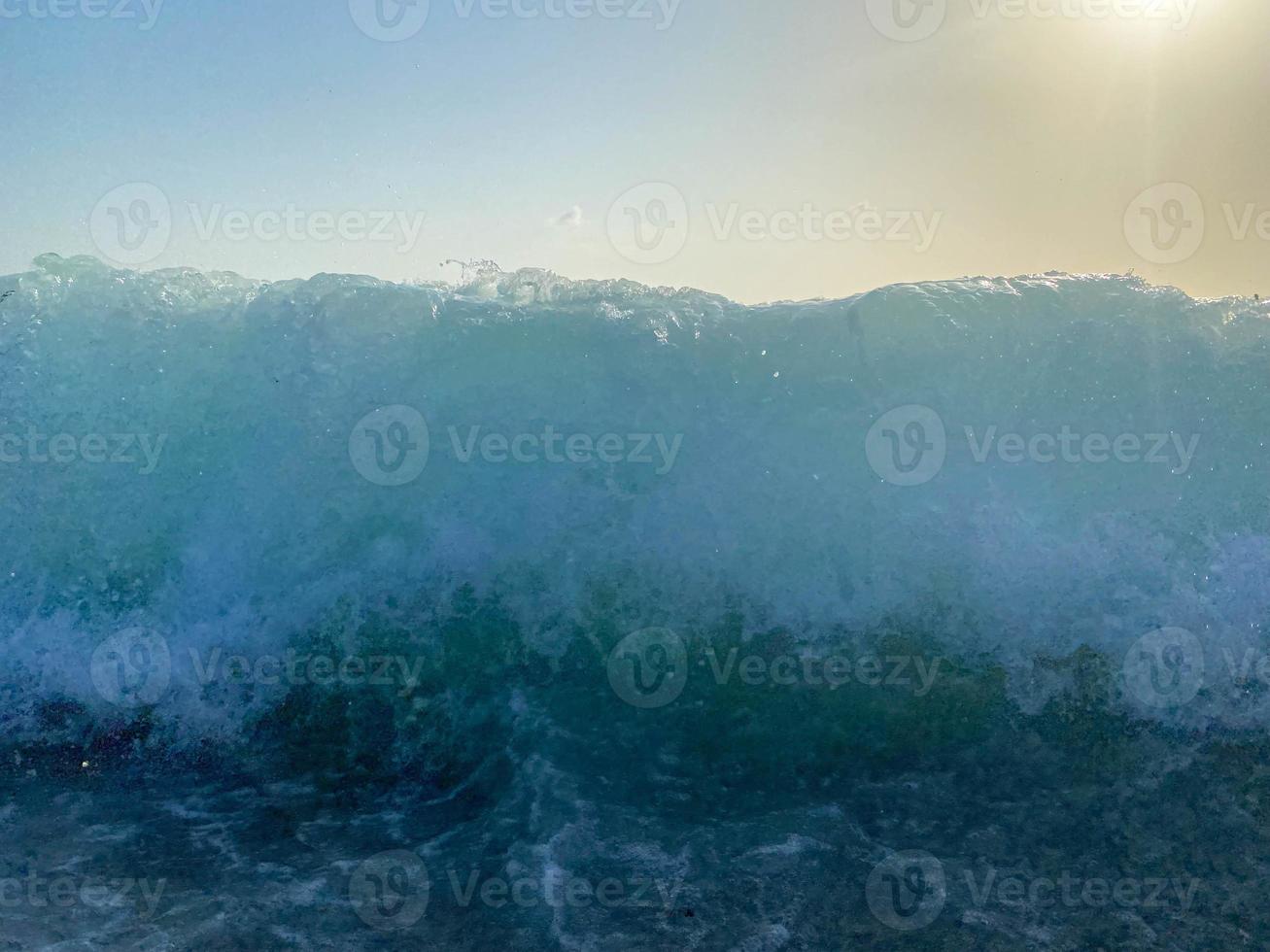 Waves, splashes of water on the beach at the sea on vacation in a tourist warm eastern tropical country southern paradise resort on vacation. The background photo