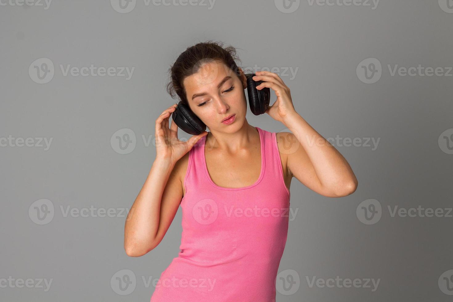 girl with headphones in studio photo