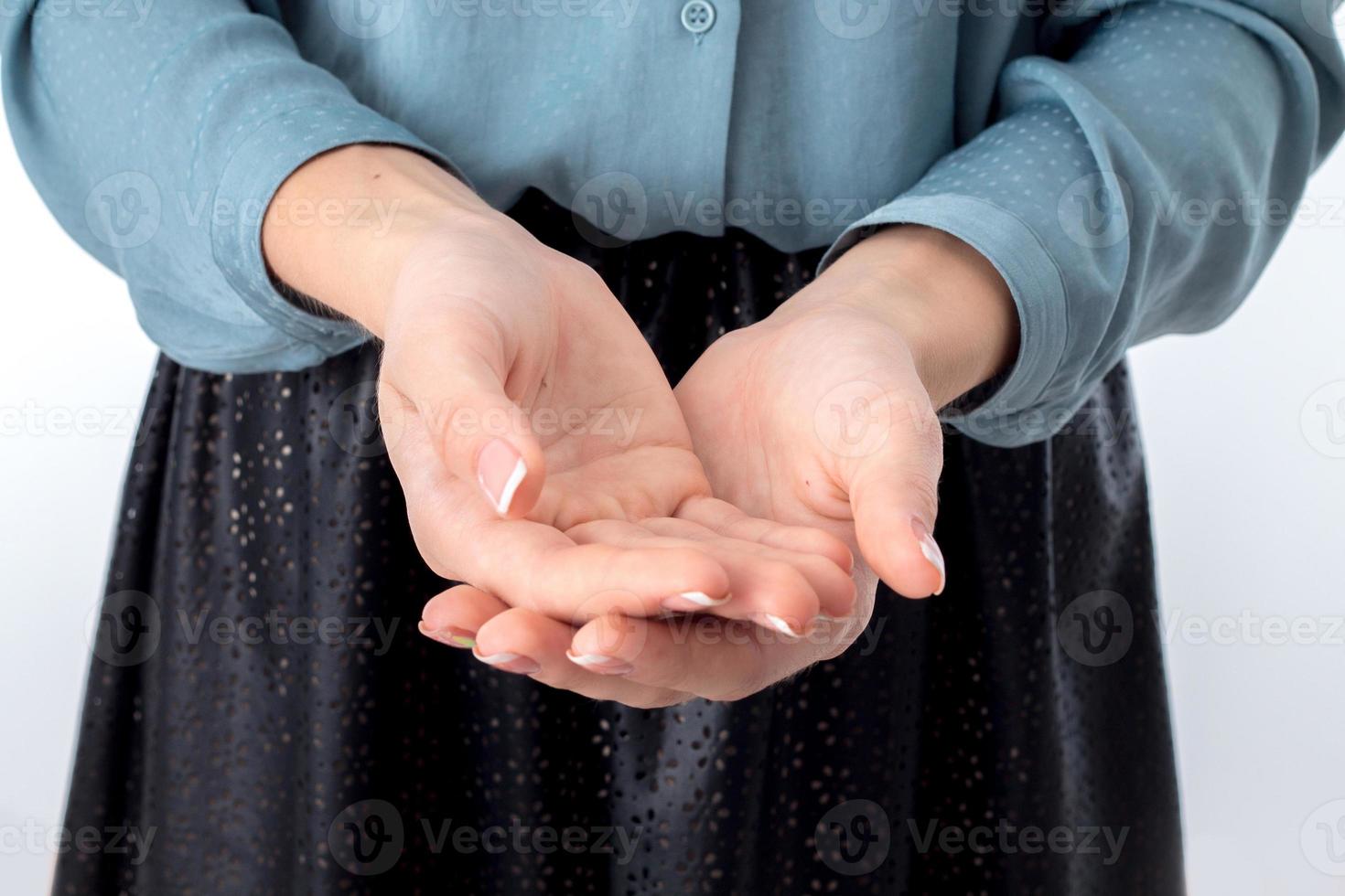two female hands outstretched before him with expanded Palms close-up photo