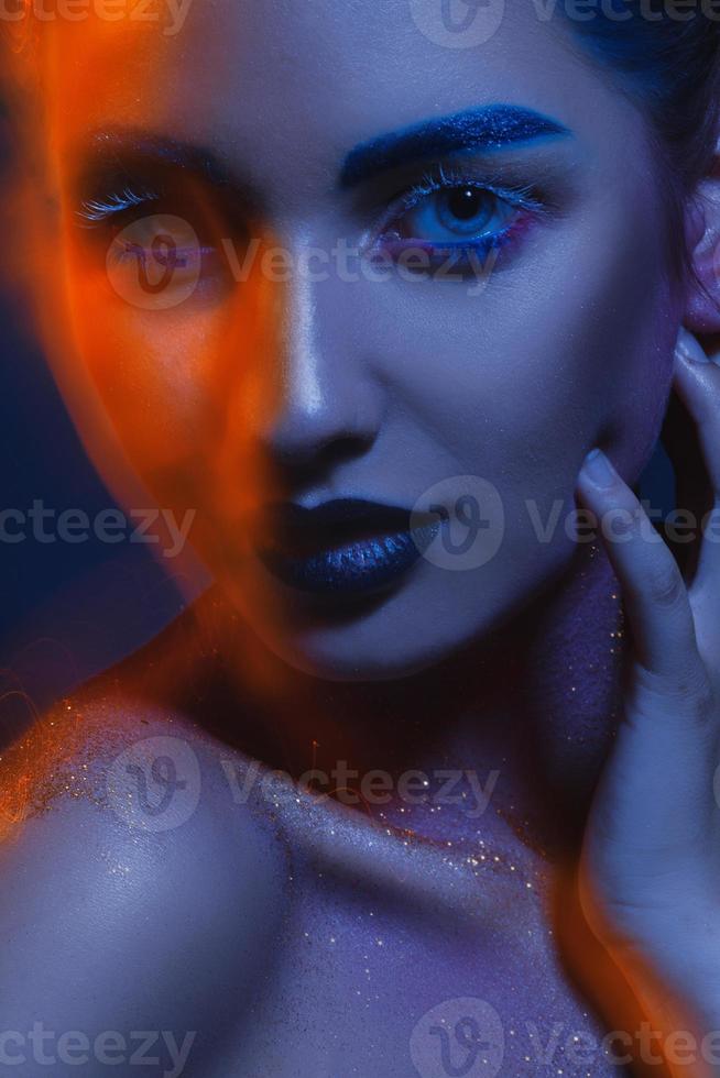 Creative portrait of cutie adult woman with mixed lights photo