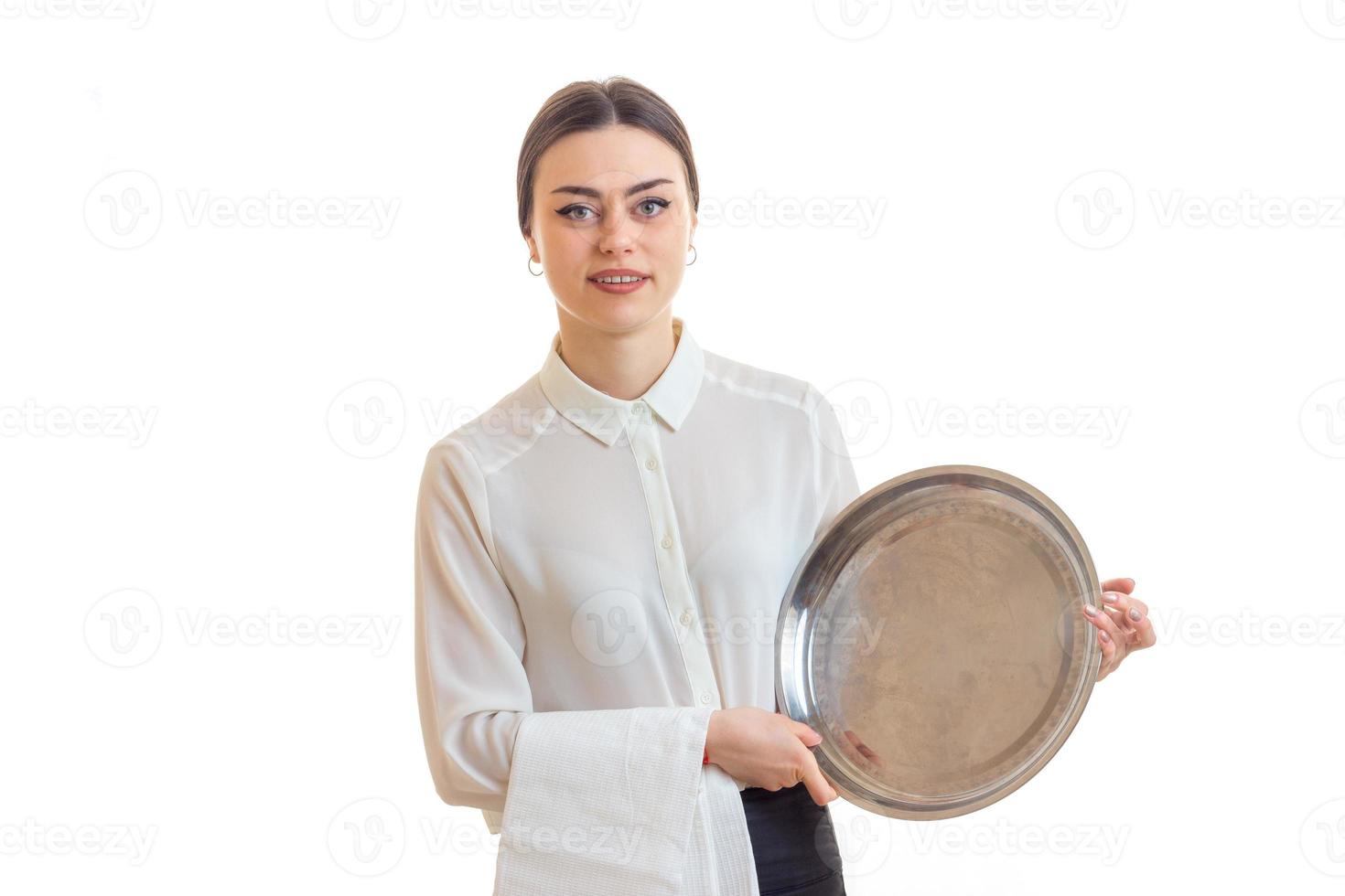 charming young waitress with trey in hands in uniform photo