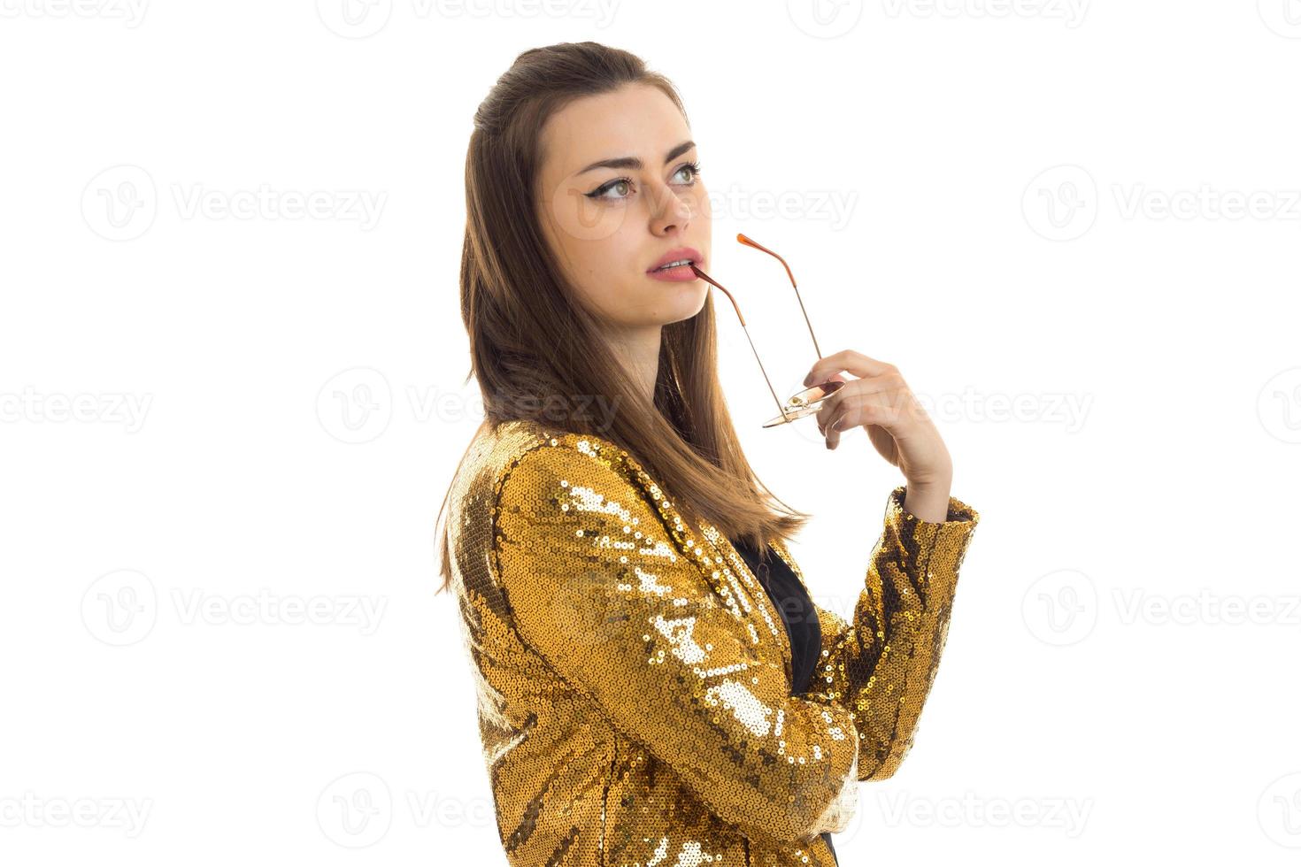 Stylish woman in golden jacket photo