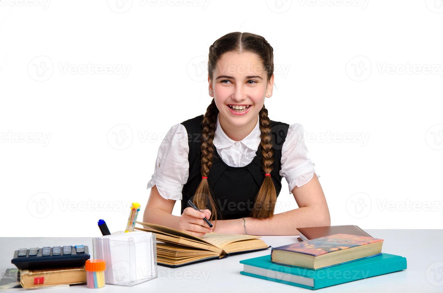 young happy schoolgirl in uniform photo