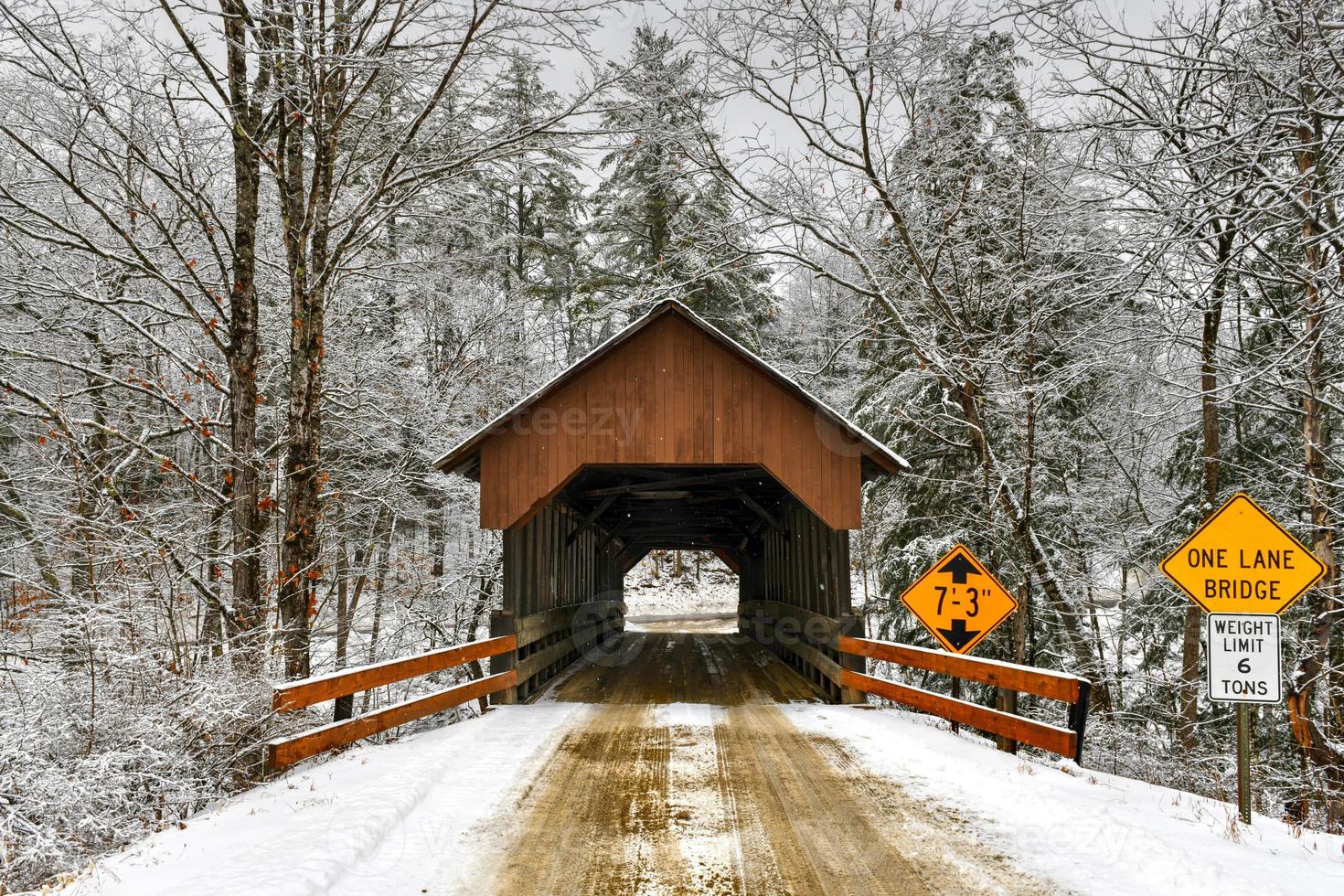 Dingleton Hill Covered Bridge in Cornish, New Hampshire during the winter. photo