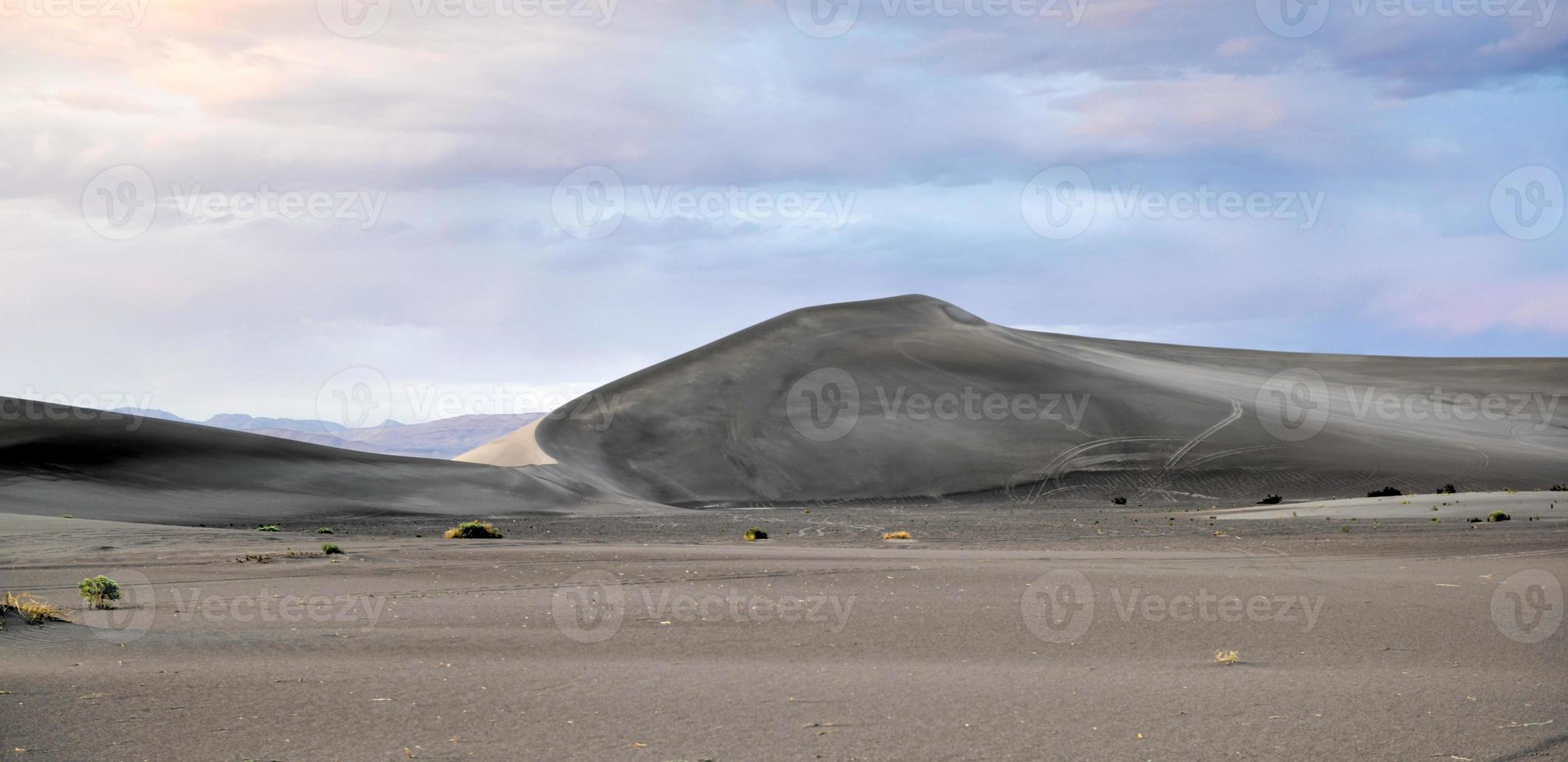 Sand Dunes along the Amargosa Desert at sunset photo