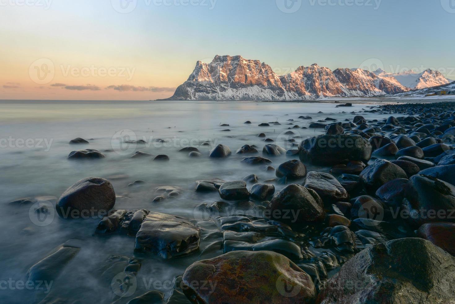 Dawn at Utakleiv Beach, Lofoten Islands, Norway in the winter. photo