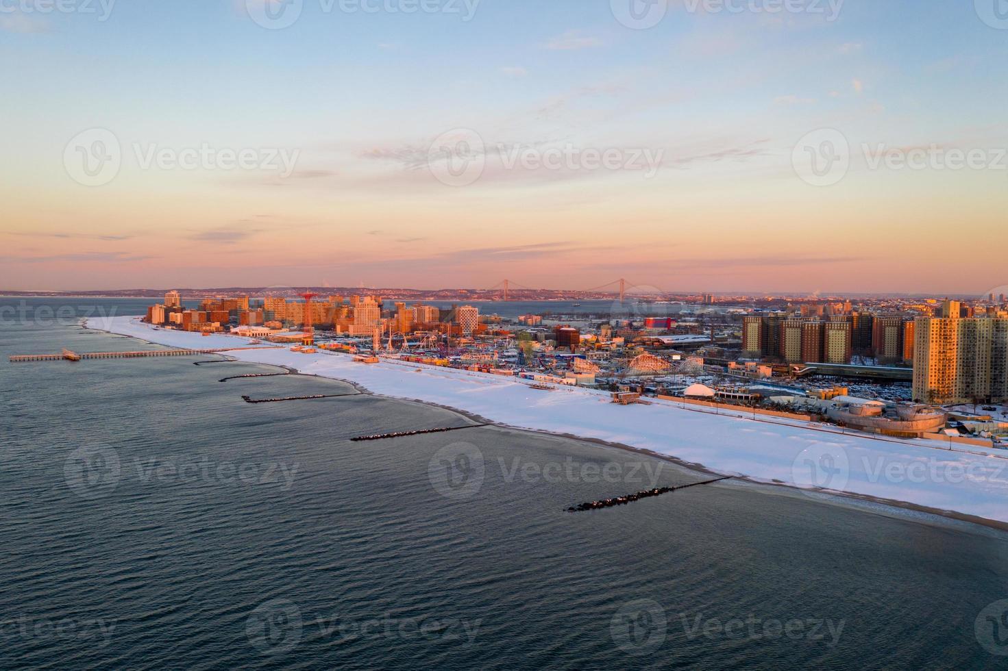 Aerial view of a snow covered Coney Island Beach during the winter at sunrise in Brooklyn, New York photo