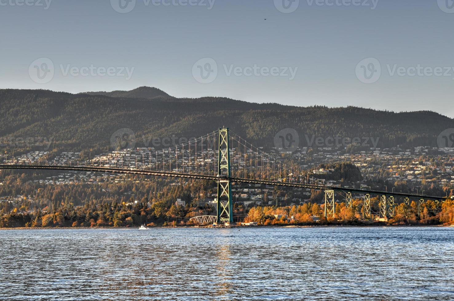 Lions Gate Bridge as seen from Stanley Park in  Vancouver, Canada. The Lions Gate Bridge, opened in 1938, officially known as the First Narrows Bridge, is a suspension bridge. photo