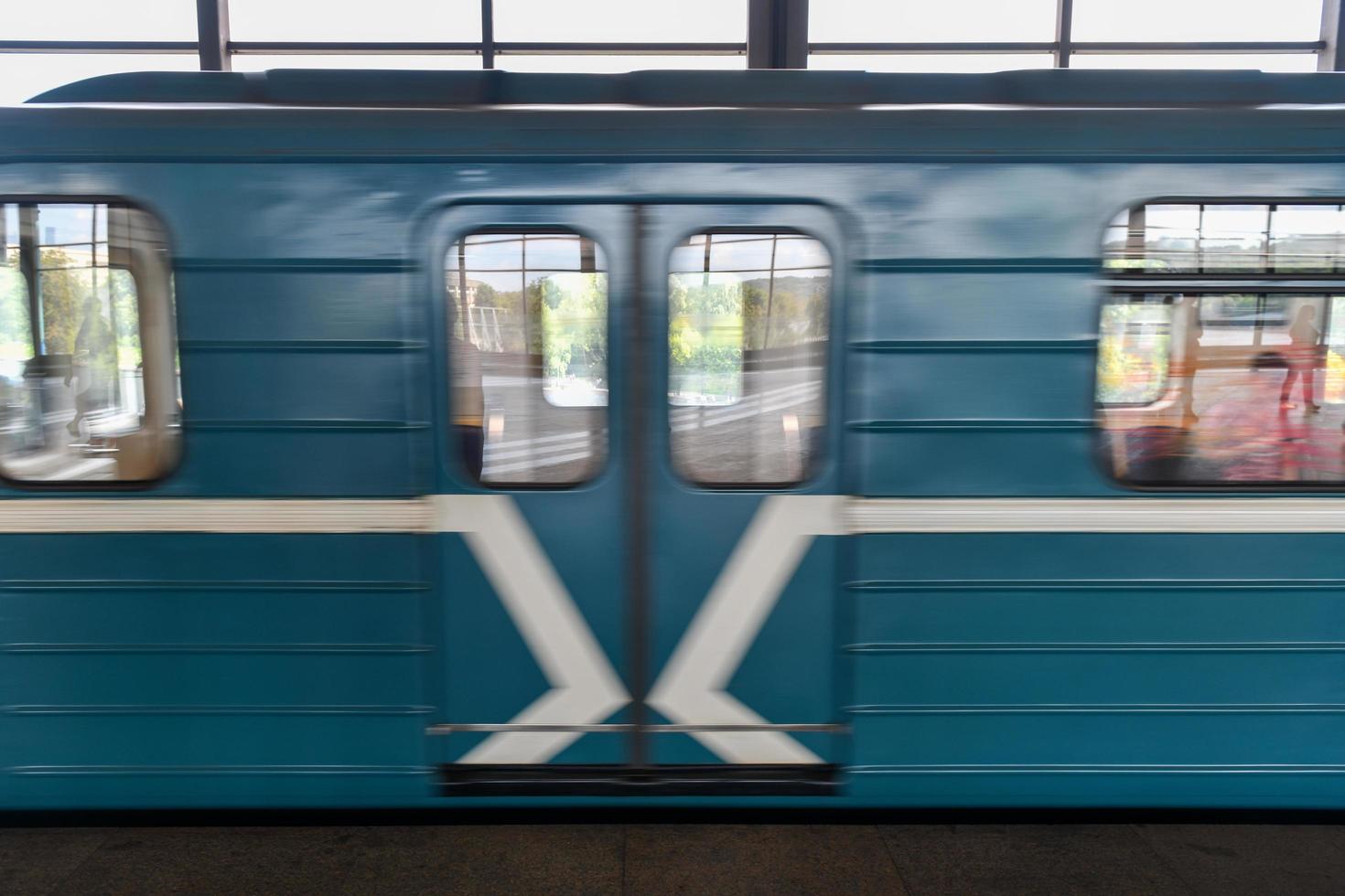 Moscow, Russia - July 26, 2019 -  Train passing through Sparrow Hills Metro station in the  Moscow underground. photo