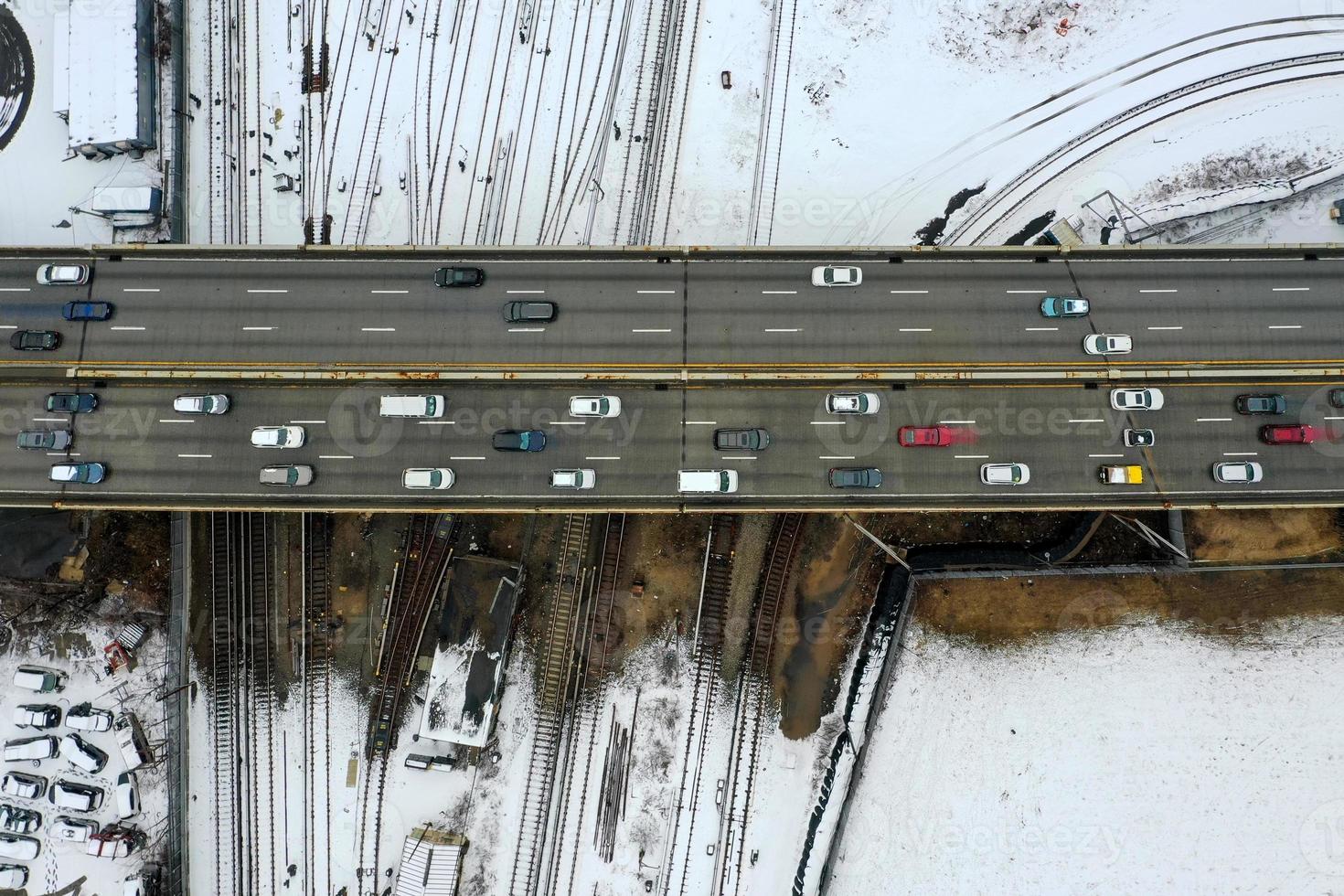 Aerial view of the snow-covered elevated train tracks extending from Coney Island and the Belt Parkway in Brooklyn, New York. photo