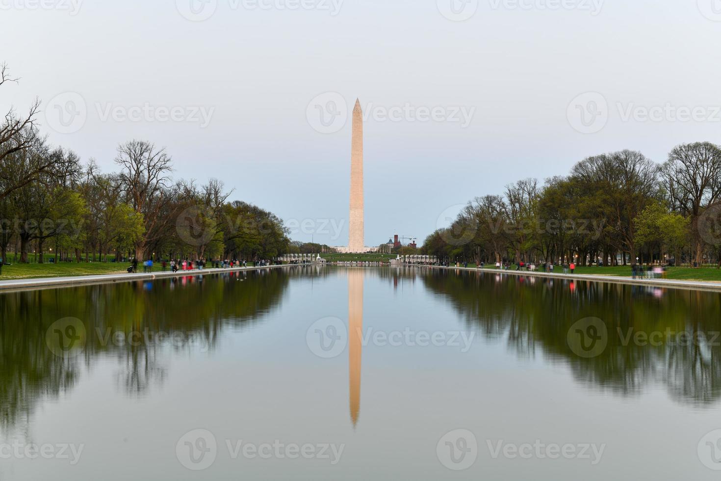 Washington Monument reflecting in the Lincoln Memorial Reflecting Pool at sunset in Washington, DC. photo