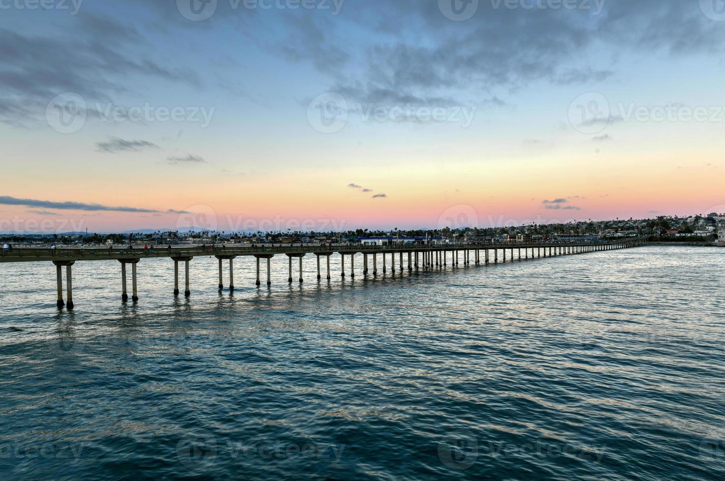 Sunset by the Ocean Beach Pier in San Diego, California. photo