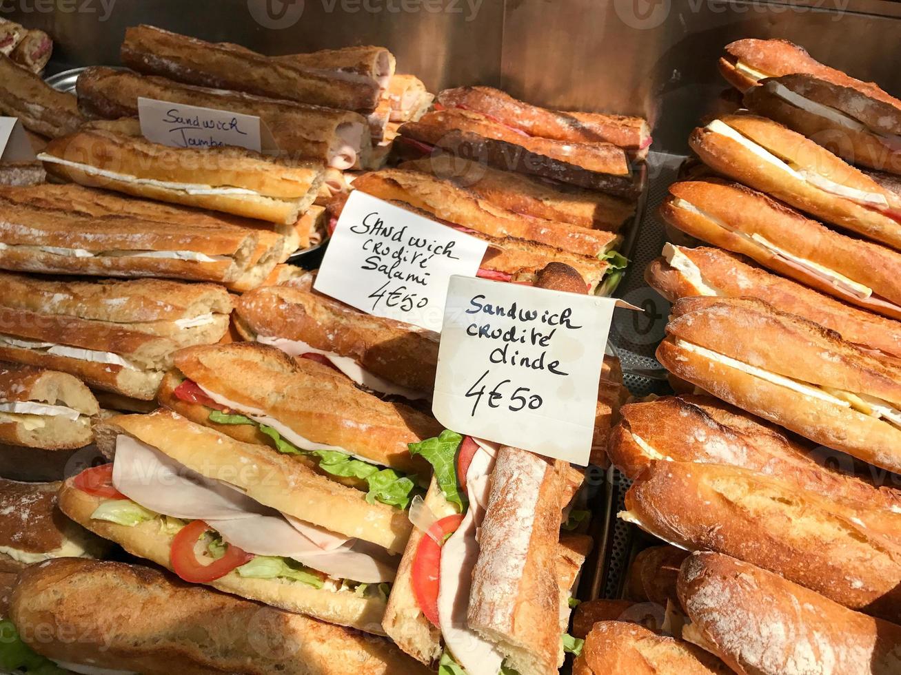 Fresh French Baguettes for sale in a window in Paris, France. photo