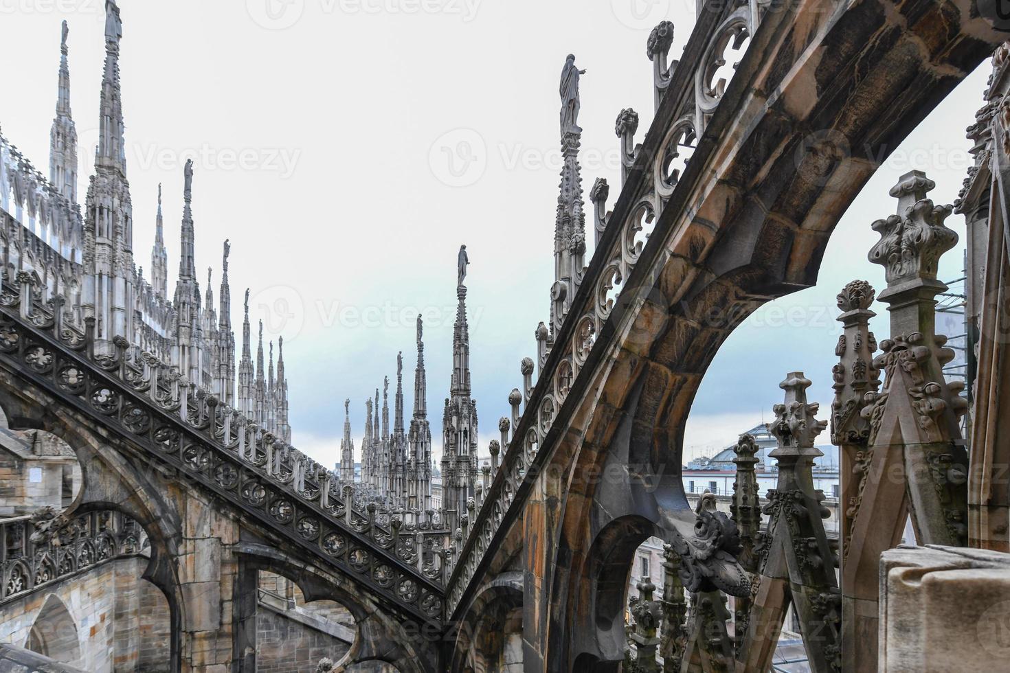 Milan Cathedral, Duomo di Milano, one of the largest churches in the world, on Piazza Duomo square in the Milan city center in Italy. photo