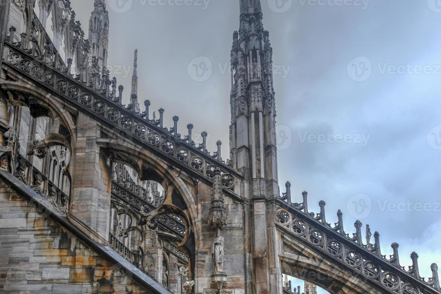 Milan Cathedral, Duomo di Milano, one of the largest churches in the world, on Piazza Duomo square in the Milan city center in Italy. photo