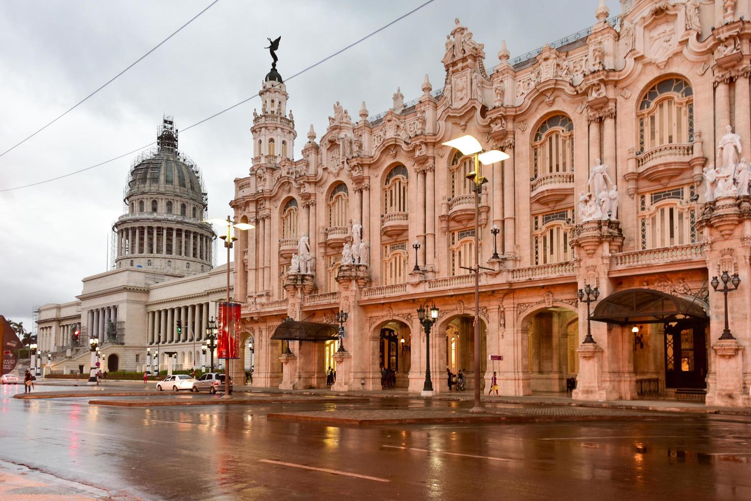 Havana, Cuba - January 7, 2017 -  Historic Hotel Inglaterra near the Central Park in Havana, Cuba with the Capitolio in the National Capital Building in the background. photo