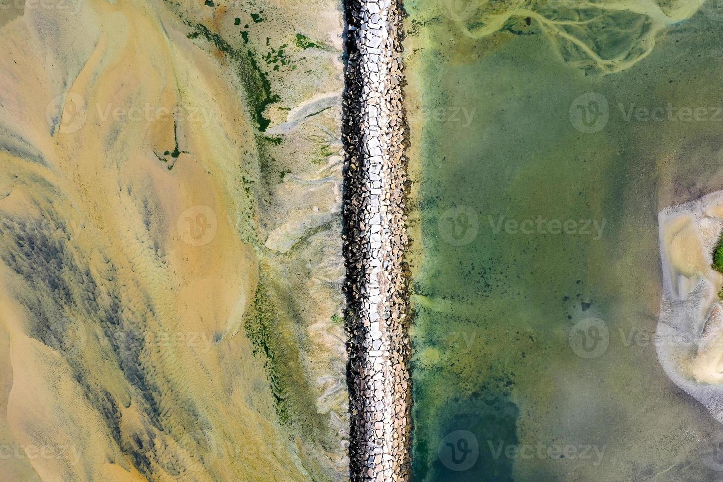 Provincetown Causeway also known as the Breakwater Walk, is an uneven collection of rocks that allows hikers to cross the harbor and reach the very tip of the Cape. photo