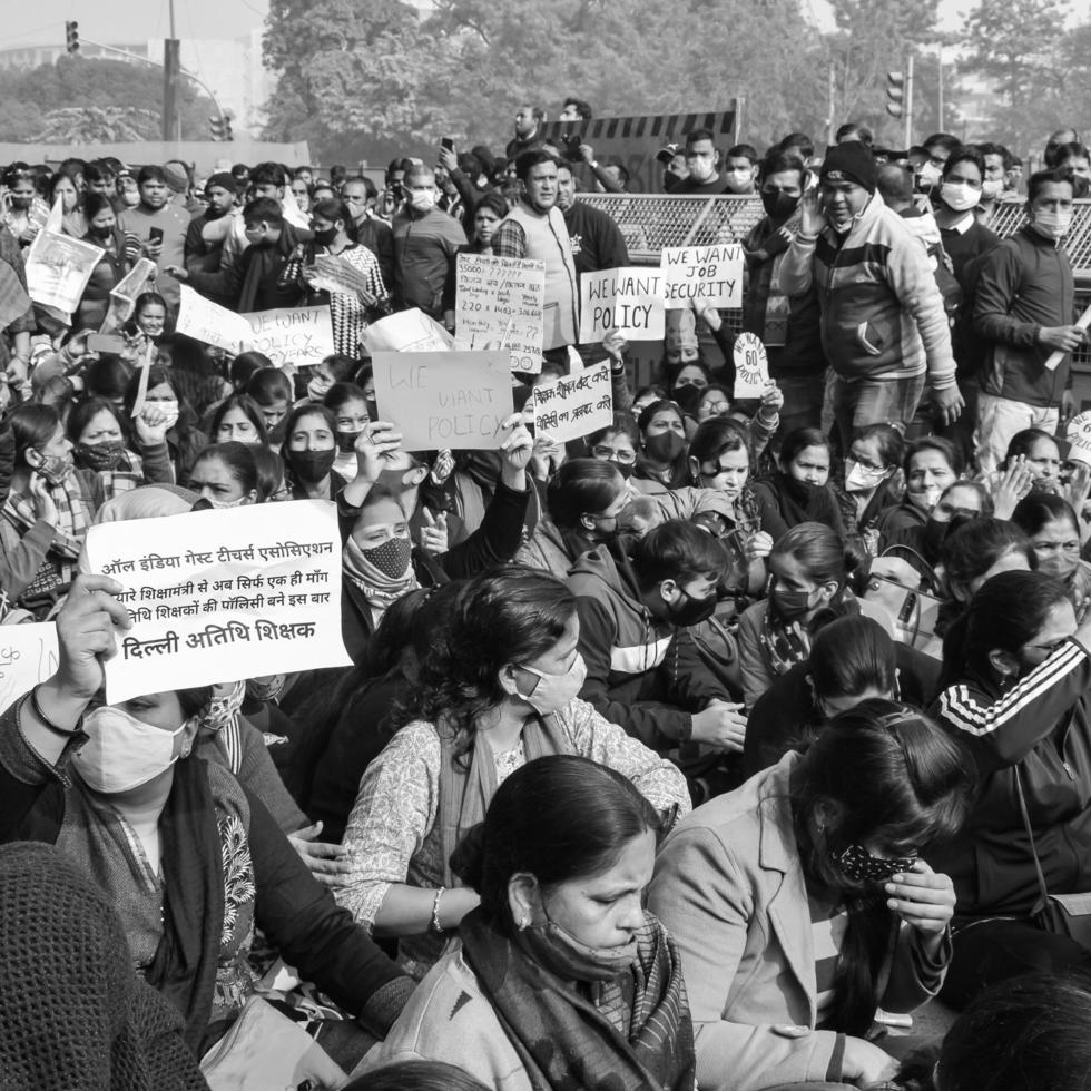 New Delhi, India December 25 2021 - Delhi Contractual Guest Teachers with posters, flags and graffitis protesting against Delhi AAP Government for making policy, Delhi Guest Teachers protesting photo