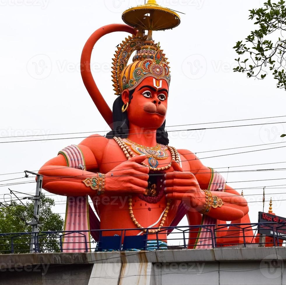 Big statue of Lord Hanuman near the delhi metro bridge situated near Karol Bagh, Delhi, India, Lord Hanuman big statue touching sky photo