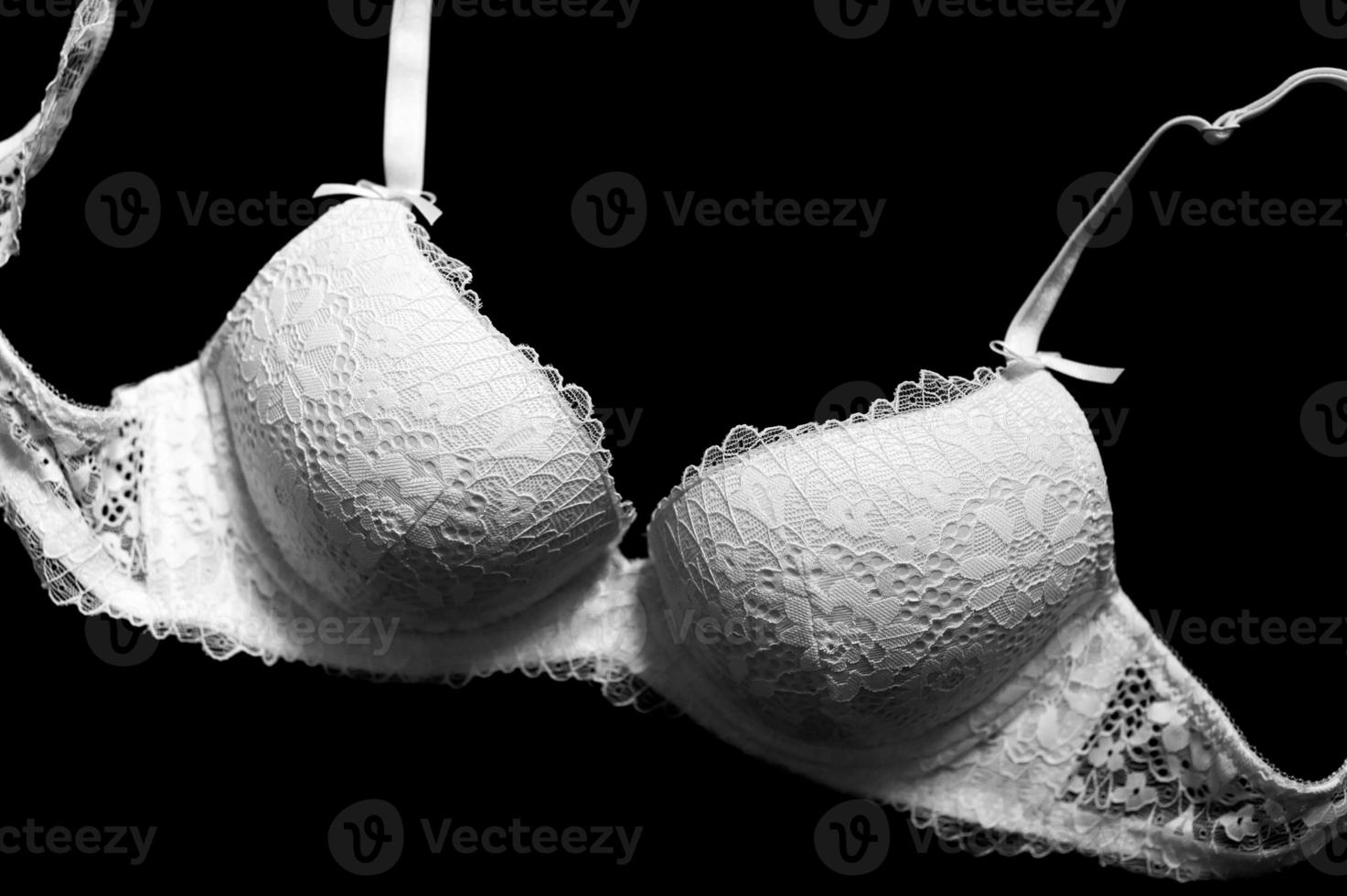 Lingerie white, removed from the top on a black background photo