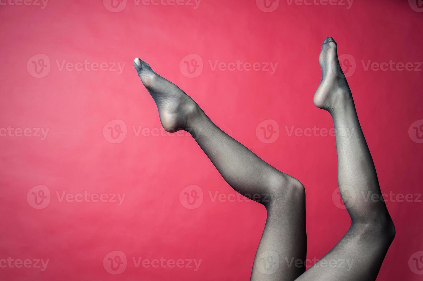 Legs of young caucasian woman in black tights photo