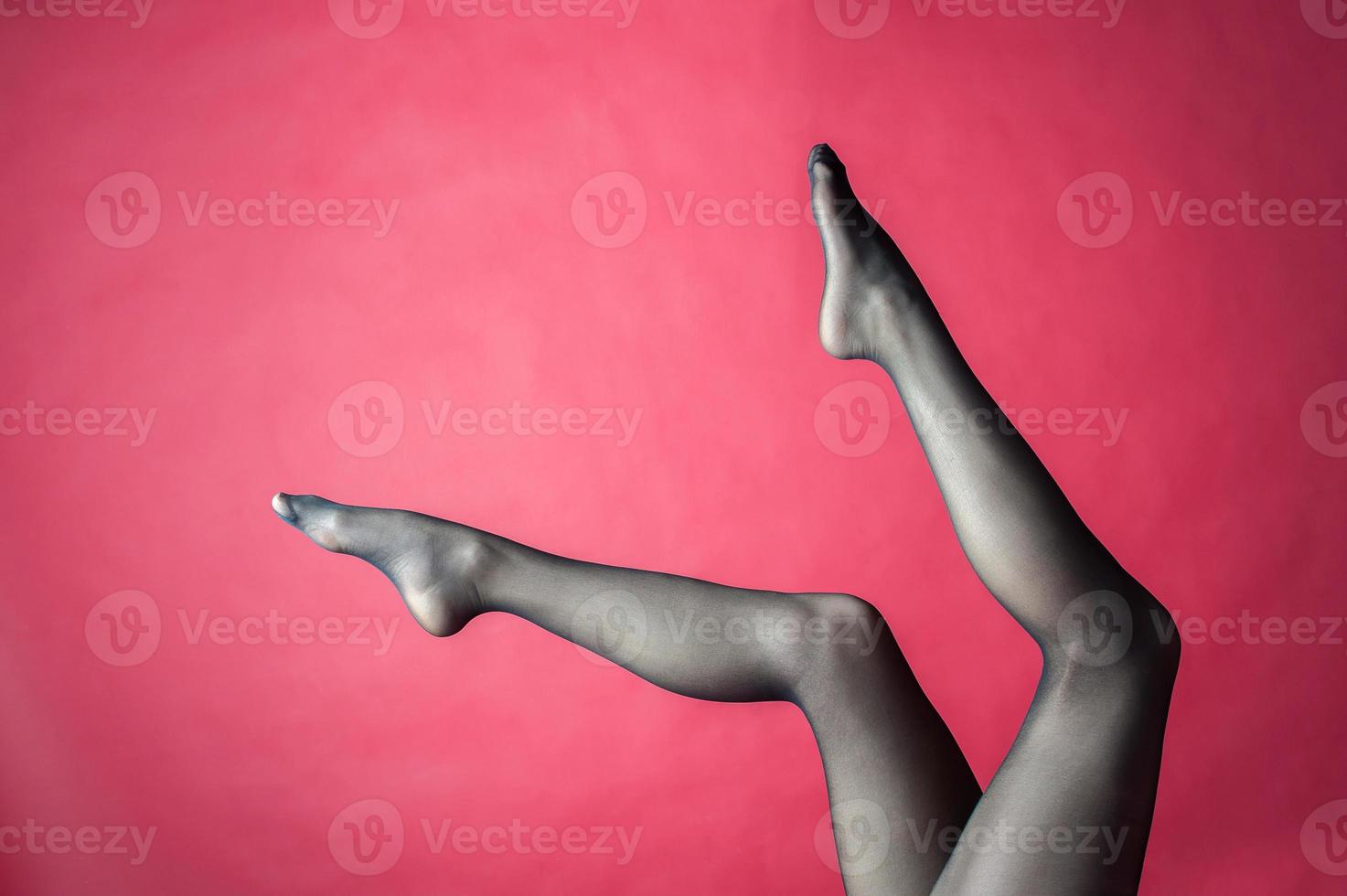 Legs of young caucasian woman in black tights photo