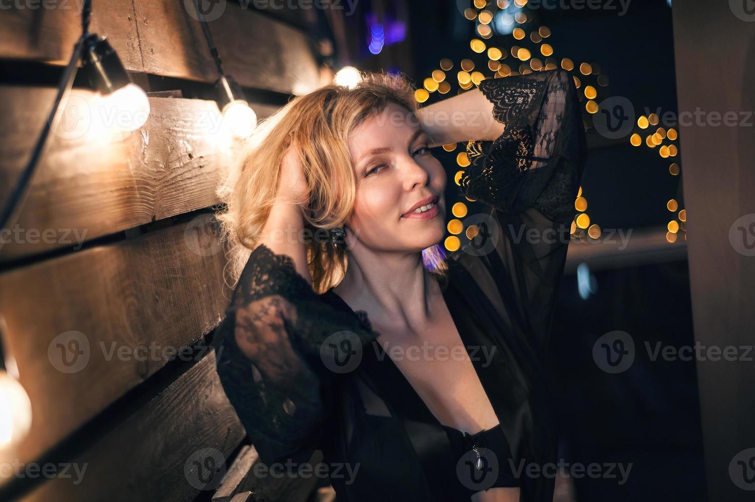 Portrait of sexy blonde on the background of evening lights photo