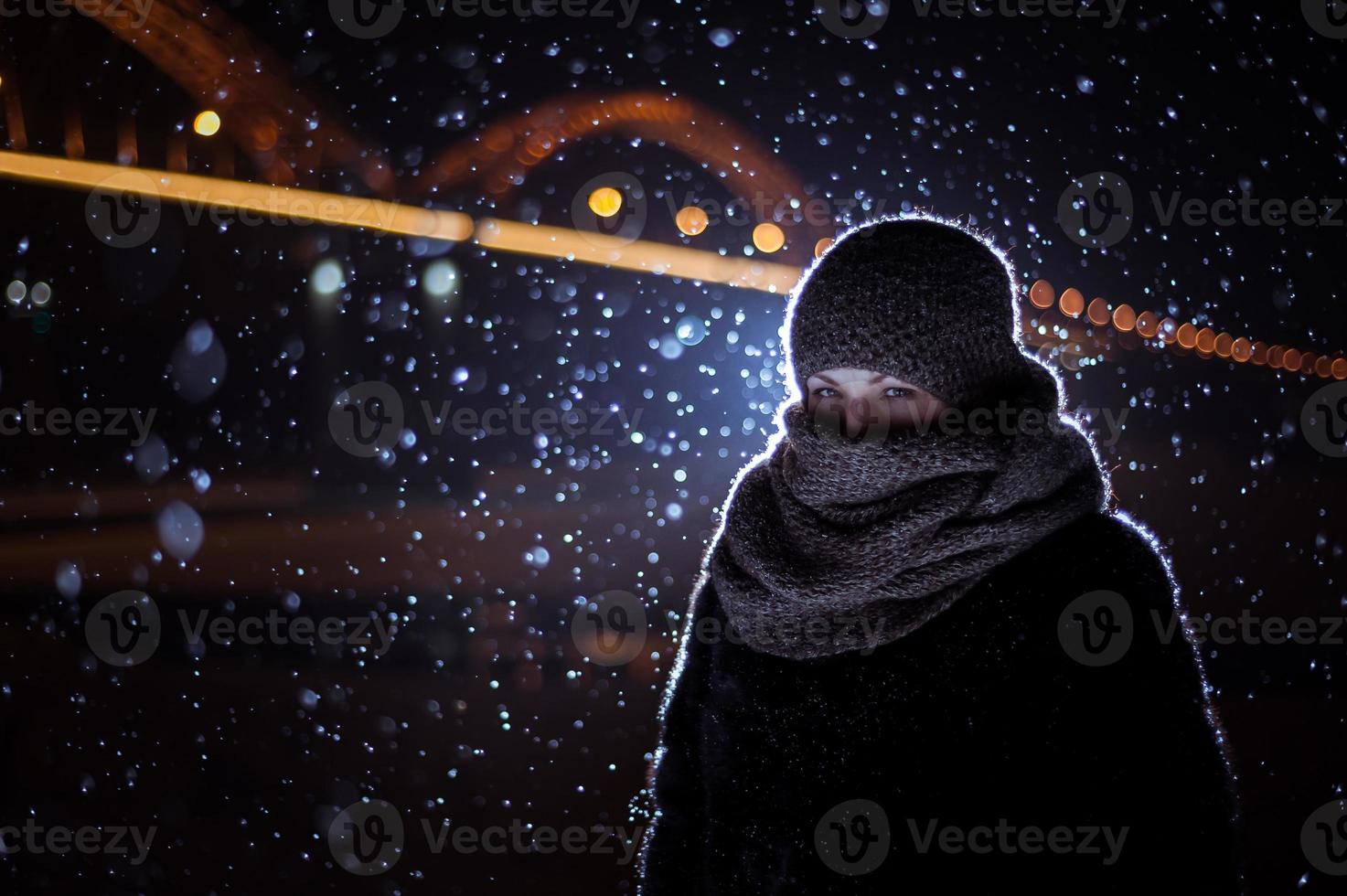 silhouette of a man on the background of falling snow in winter photo