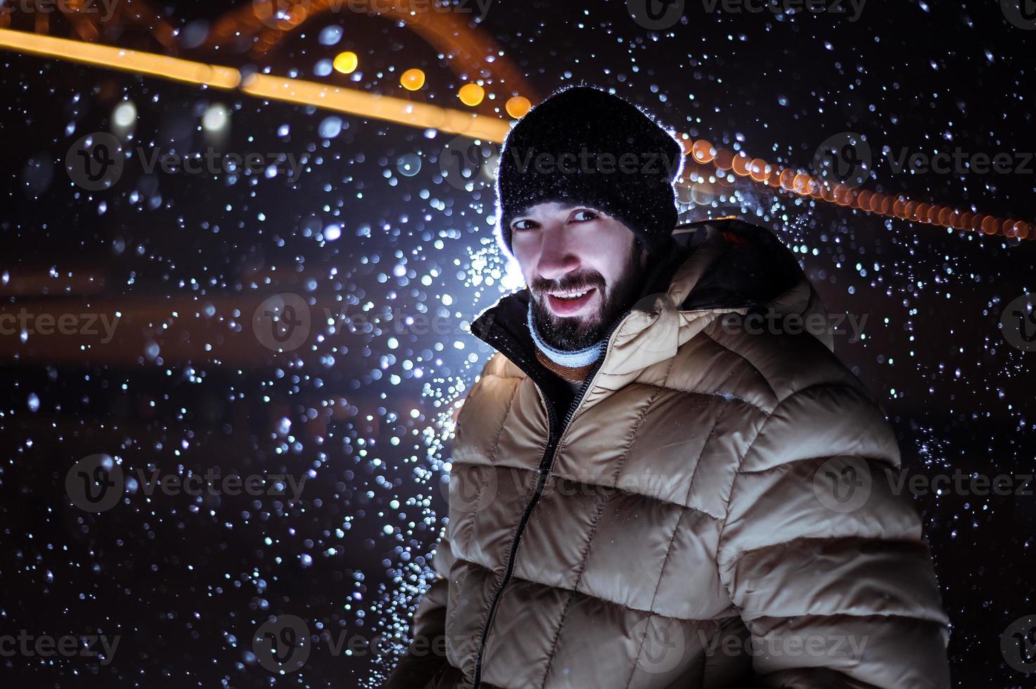 silhouette of a man on the background of falling snow in winter photo