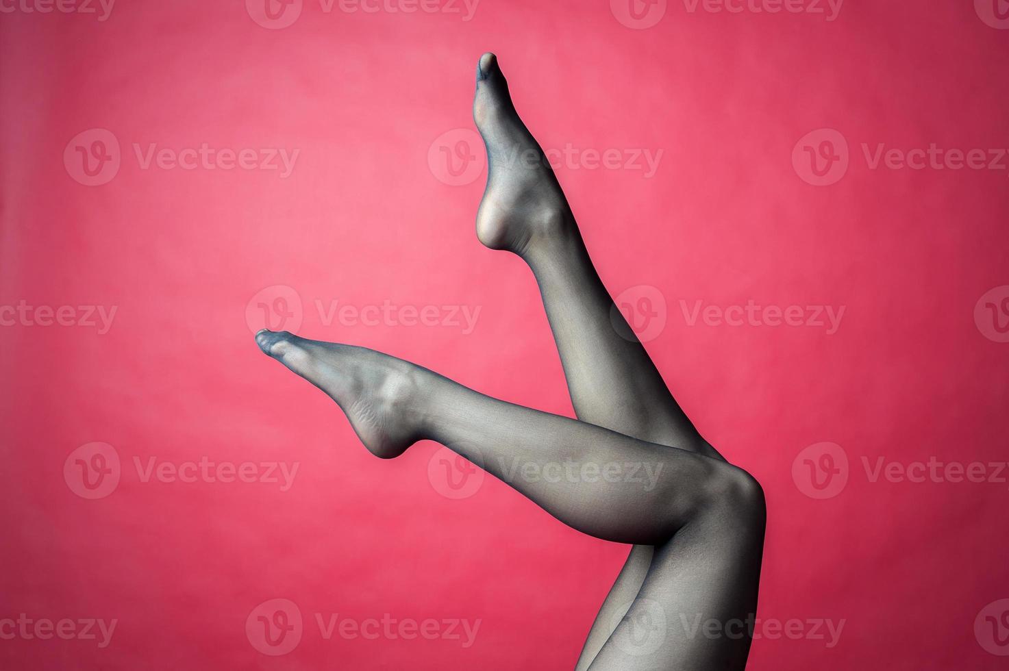 Legs of young caucasian woman in black tights photo