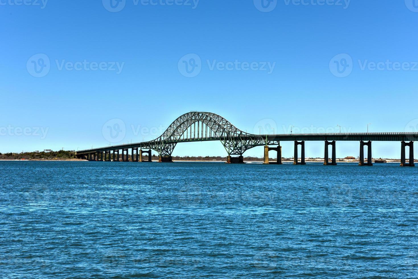 The Fire Island Inlet Bridge, an integral part of the Robert Moses Causeway, is a two-lane, steel arch span with a concrete deck that carries the parkway over Fire Island Inlet. photo