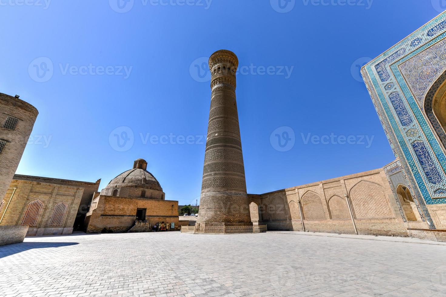 Great Minaret of the Kalon in Bukhara, Uzbekistan. It is a minaret of the Po-i-Kalyan mosque complex in Bukhara, Uzbekistan and one of the most prominent landmarks in the city. photo