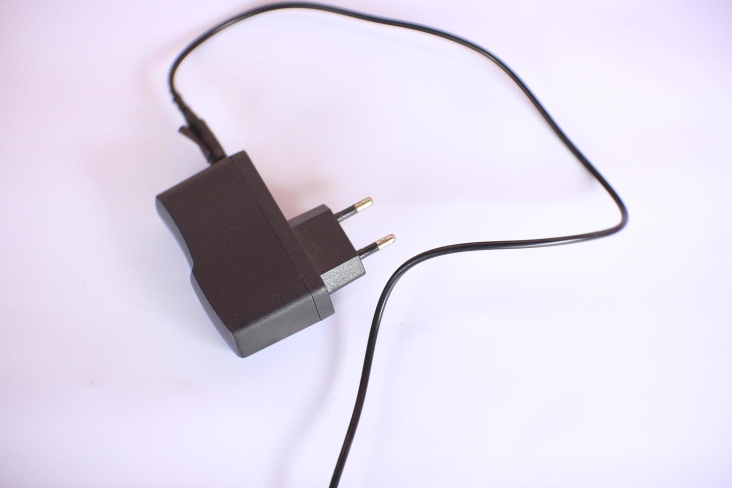 Charger adapter with black color on an isolated white background. photo