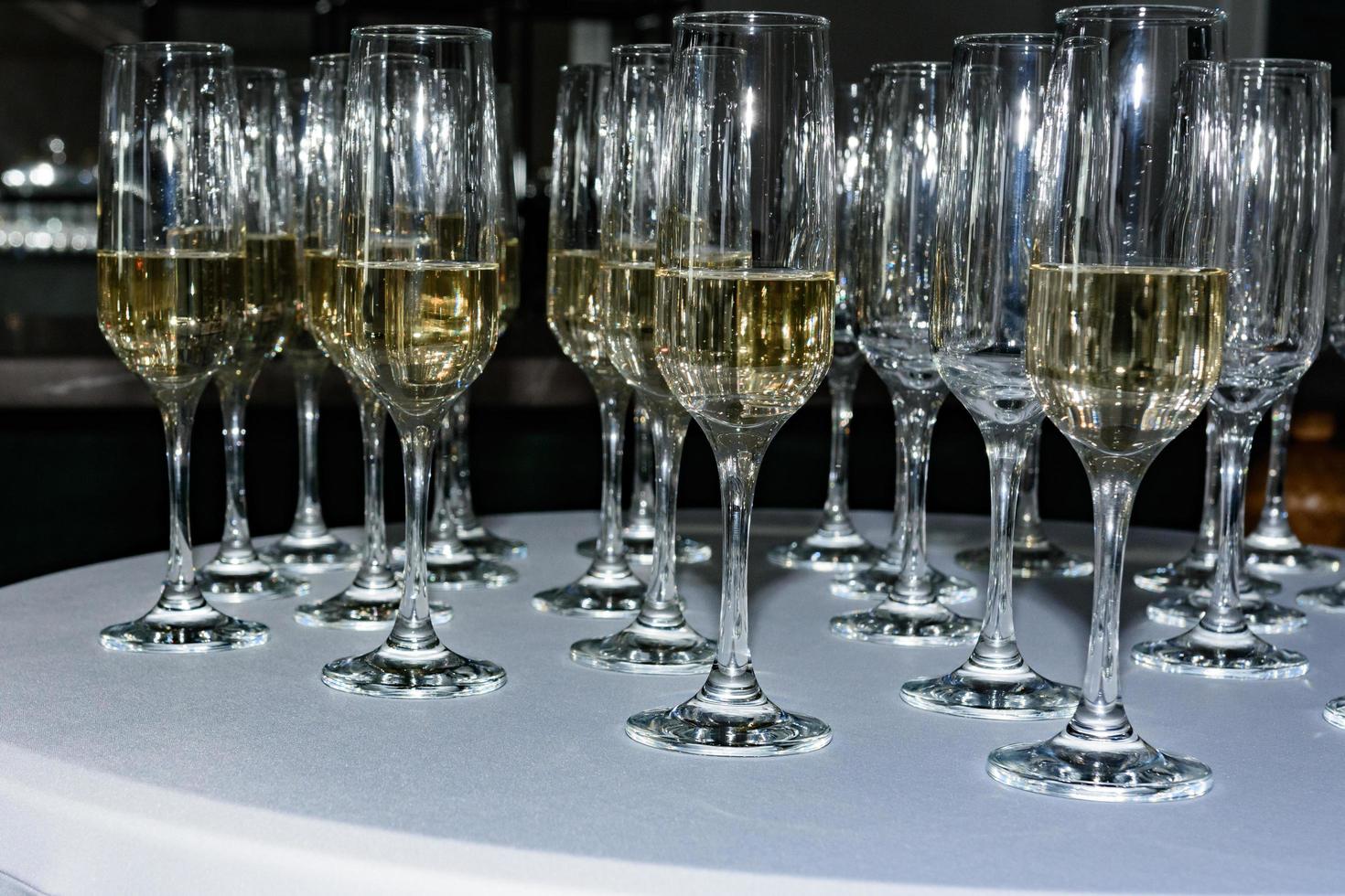 Serving champagne glasses at a solemn event. photo