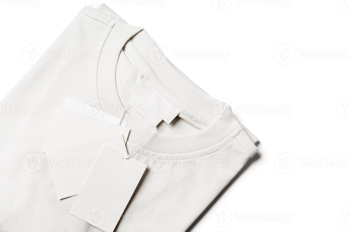 T-shirt with blank paper labels on white background photo