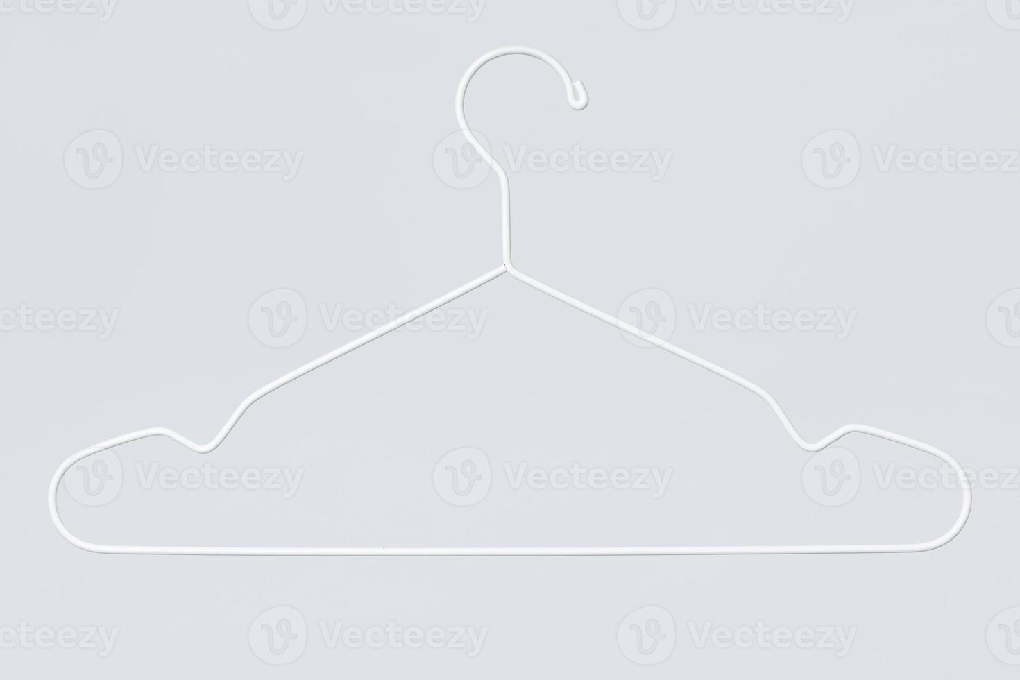 Empty white metal hanger on gray background photo