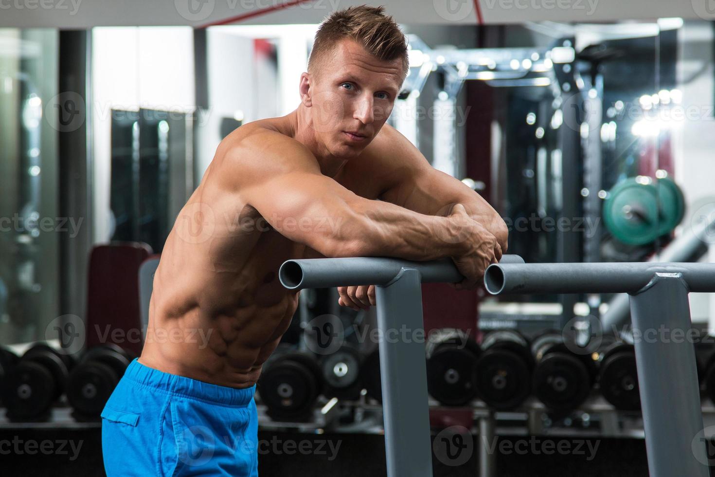 Advertising shot of a extreme bodybuilders in the gym. Concept