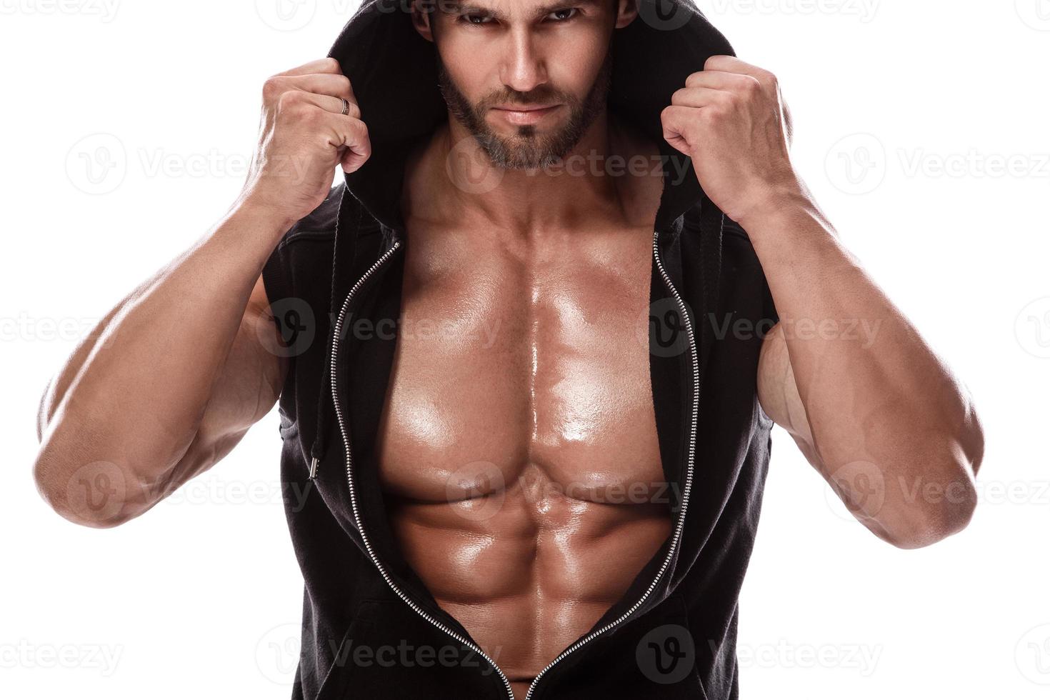 Handsome muscular man posing in studio on white background photo