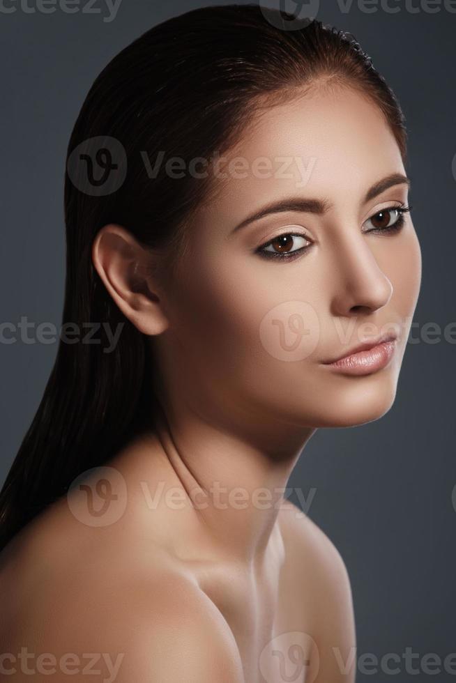 Portrait of beautiful brunette with stylish make-up photo