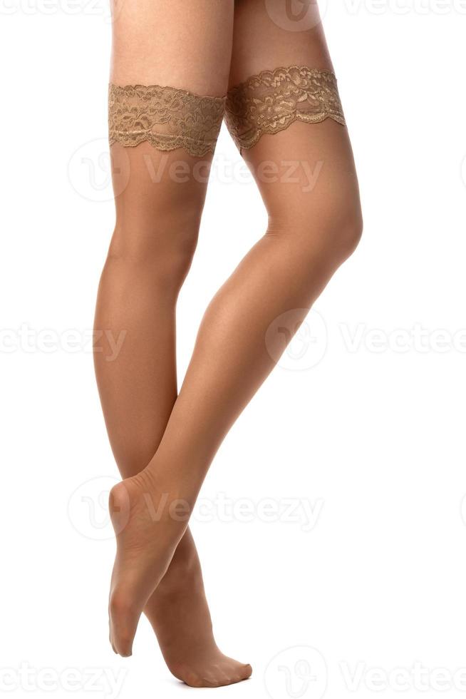 Female legs in nude stockings photo