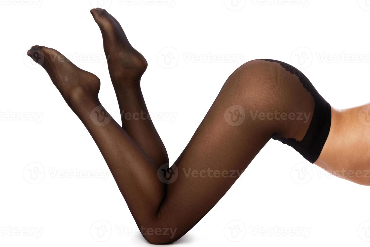 Female legs in black pantyhose photo