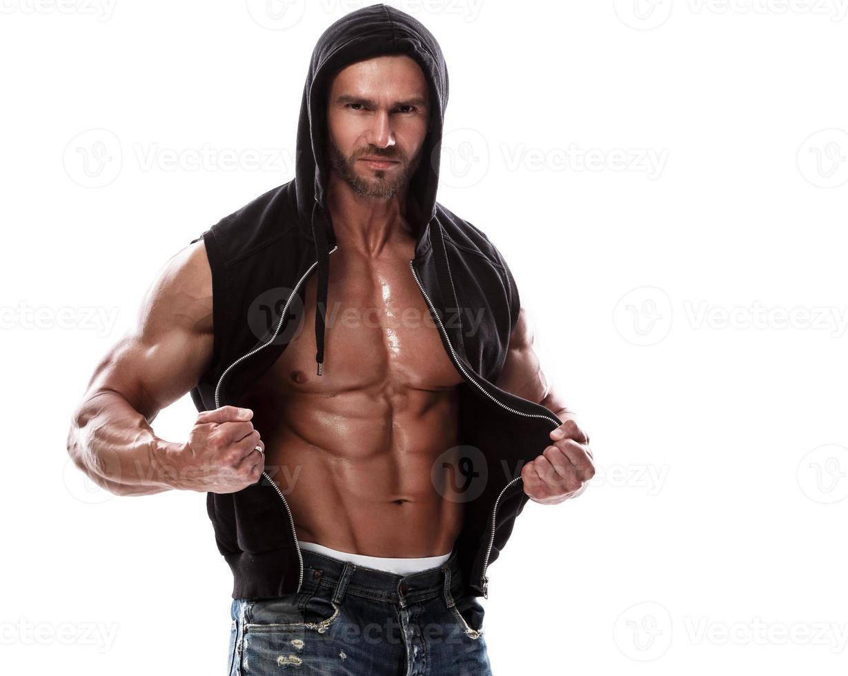 Handsome muscular man posing in studio on white background photo