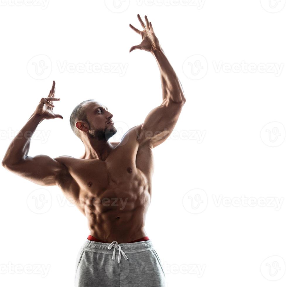 Muscular guy with sexy body on white background photo