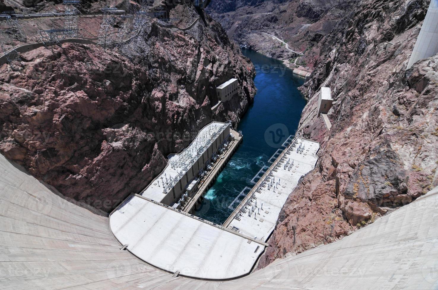 Hoover Dam, originally known as Boulder Dam, a concrete arch-gravity dam in the Black Canyon of the Colorado River, on the border between the U.S. states of Nevada and Arizona. photo